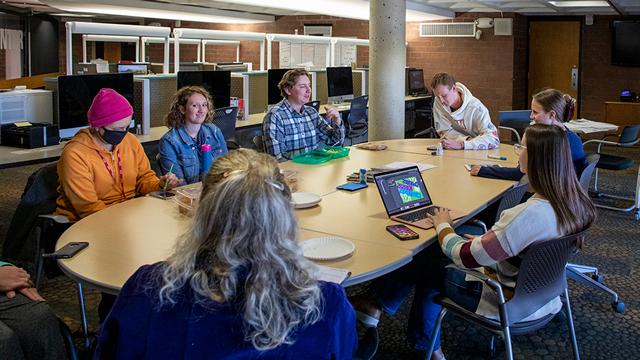 Student editorial team for the Campus Ledger having a meeting